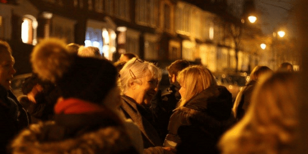 People enjoying Christmas event in street