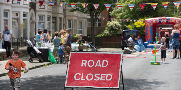 Road closed sign at street party