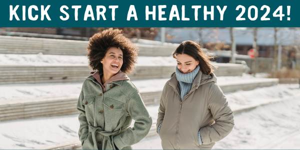 Two women walking and smiling in winter 