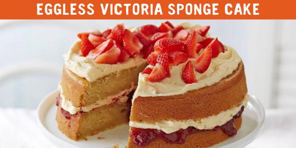 Victoria sponge cake with strawberries on top, with text: 'Eggless victoria sponge' 