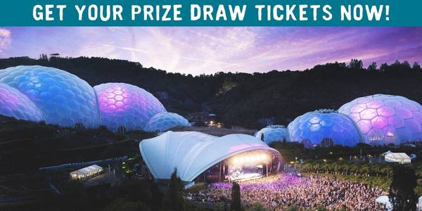 Photo of the Eden Project Sessions concert at night time with stage lit up and text: 'Get your Prize draw tickets'