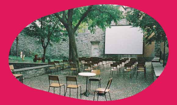 Cinema screen outside with chairs
