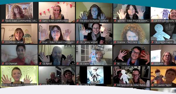 Community action course video call with particpants holding hands up